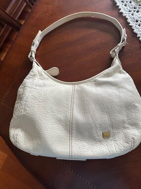 The Sak Cream Pebbled Leather Shoulder Bag with Gold Logo
